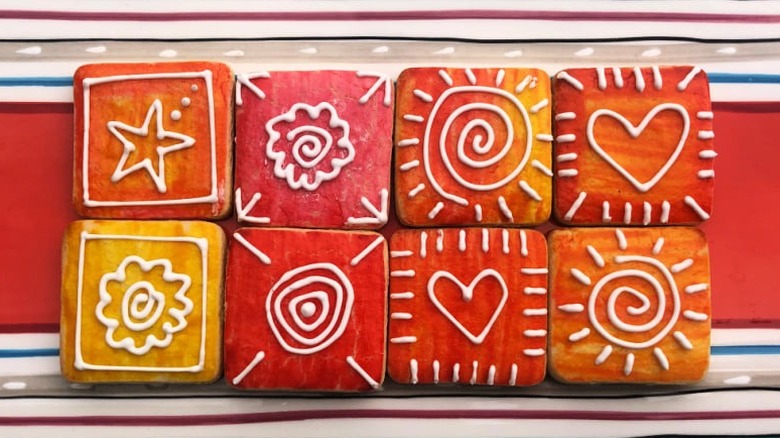 Painted sugar cookies with white icing designs