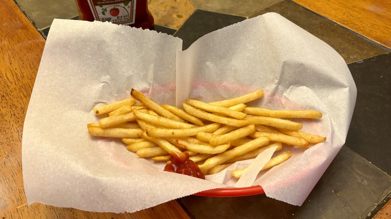 basket of fries and ketchup