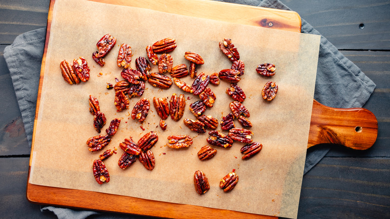 candied pecans on cutting board
