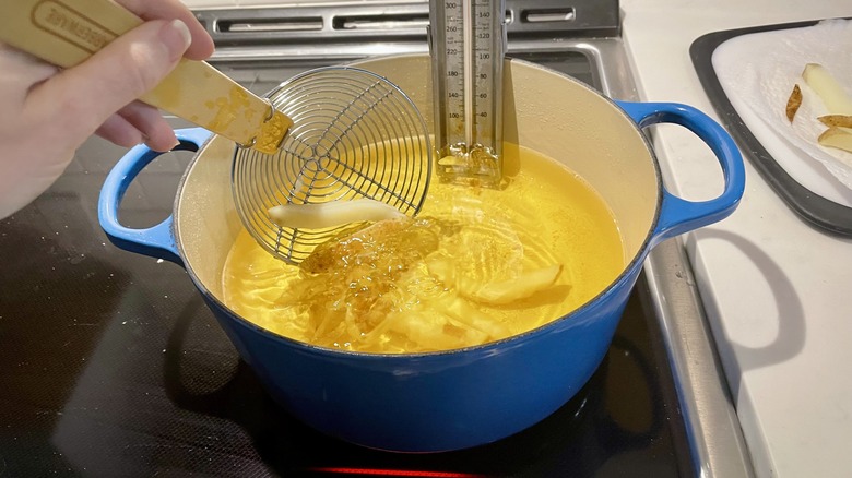 potatoes dropped into oil