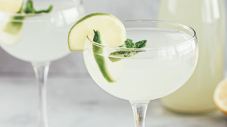 martini garnished with mint and lime
