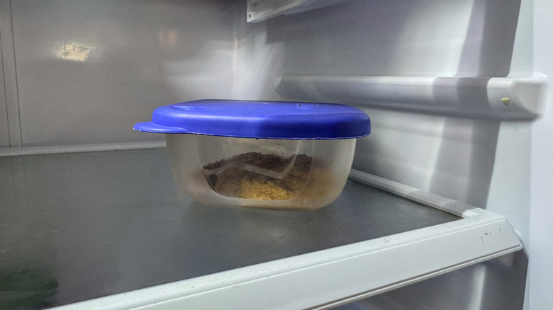 Container of peanut butter in the refrigerator