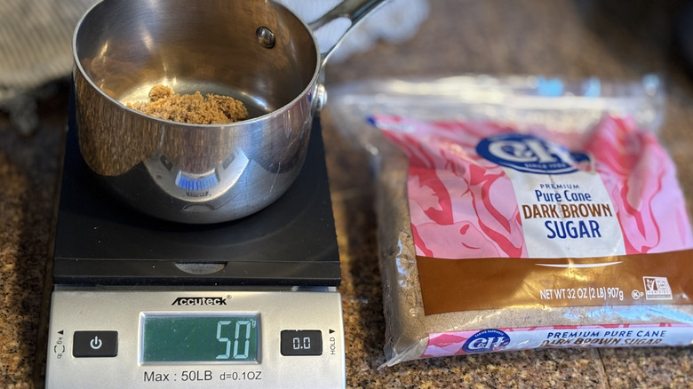 brown sugar in a sauce pot on kitchen scale