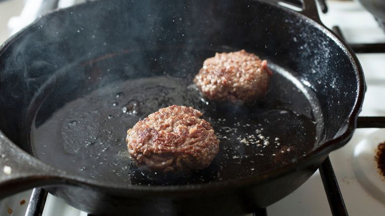 Wagyu burger patties on the grill.
