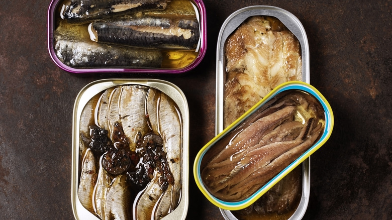 open tins of canned seafood