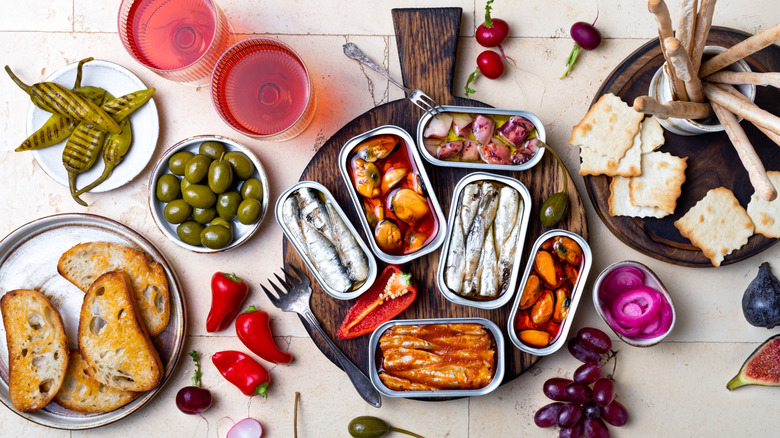tinned fish snack board with olives and bread