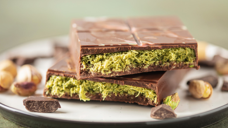 Dubai chocolate bar snapped in half on a plate