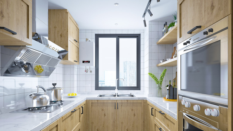 Modern C-shaped kitchen with wood cabinets