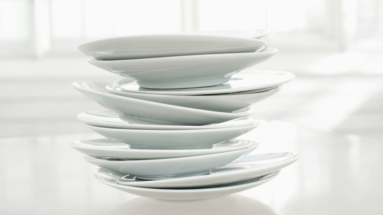stacks of bluish and grayish white plates