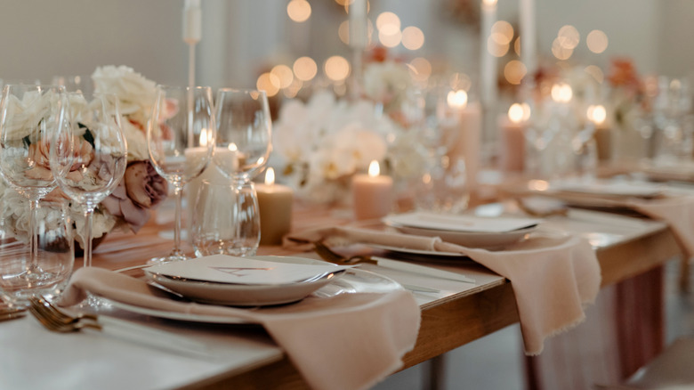 plates and napkins in elegant stack on wedding table