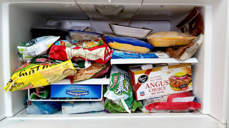 Messy freezer with boxed items