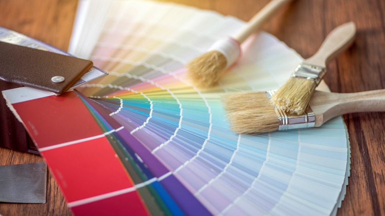 paint card booklet spread out with paintbrushes