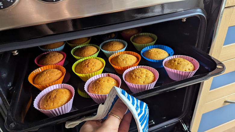 Golden cupcakes coming out of oven.