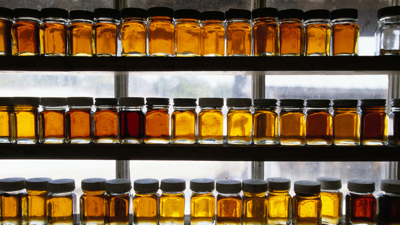 bottles of maple syrup of various colors