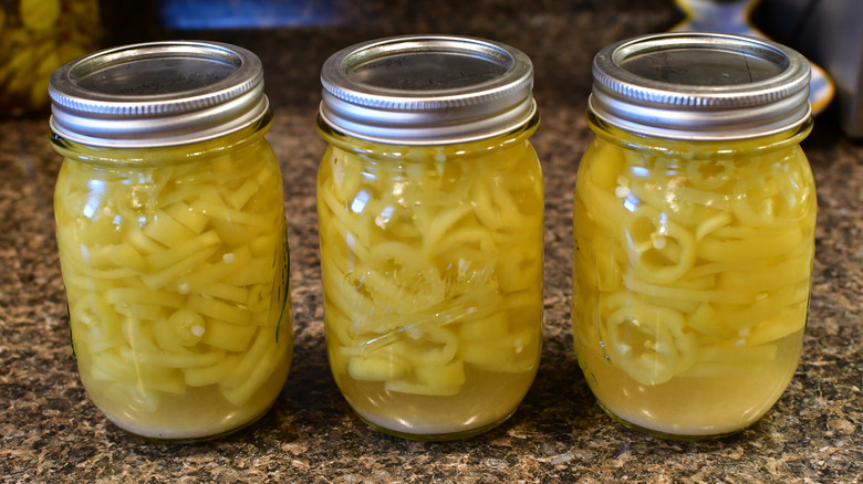 pickled banana peppers stored in jars