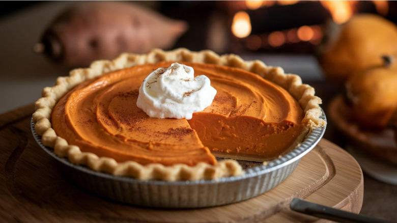 Sweet potato pie topped with whipped cream