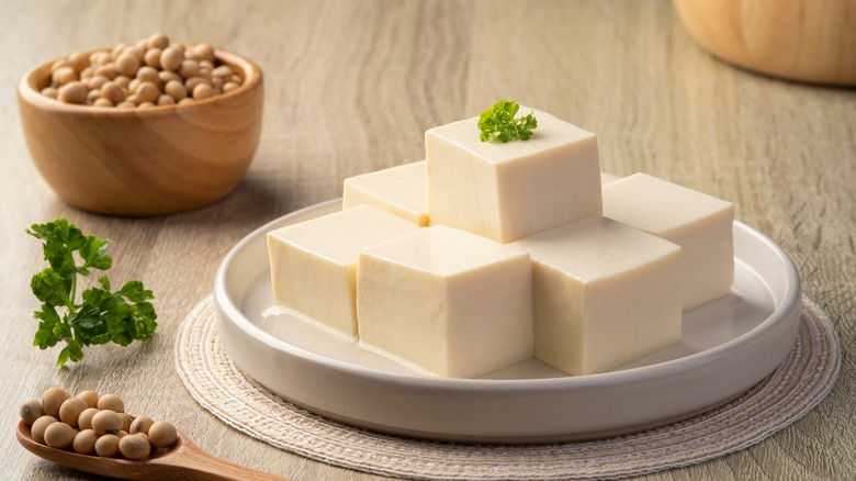 Tofu cubes stacked on white plate