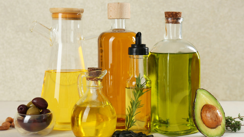 collection of cooking oils in glass bottles