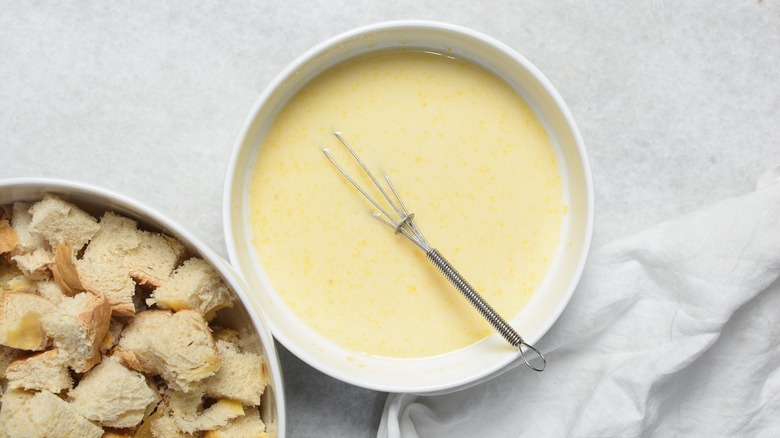 Overhead view of custard for making bread pudding, process of making bread pudding