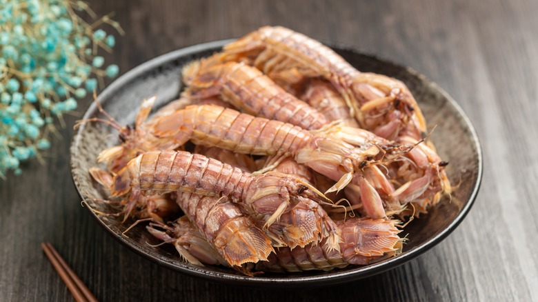 shrimps with seasoning in a plate on a table