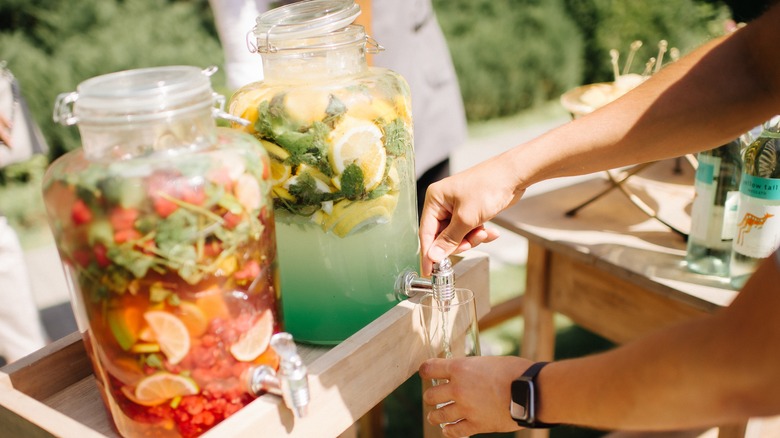Buffet cart with containers of lemonade