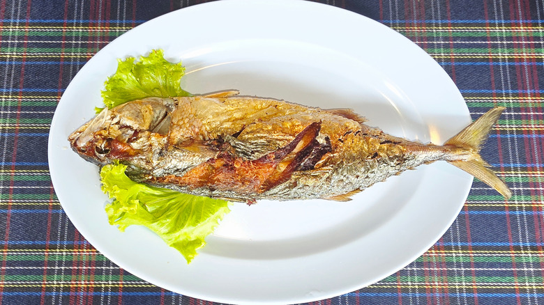 A fried mackerel, perfect for filling a sushi sandwich with