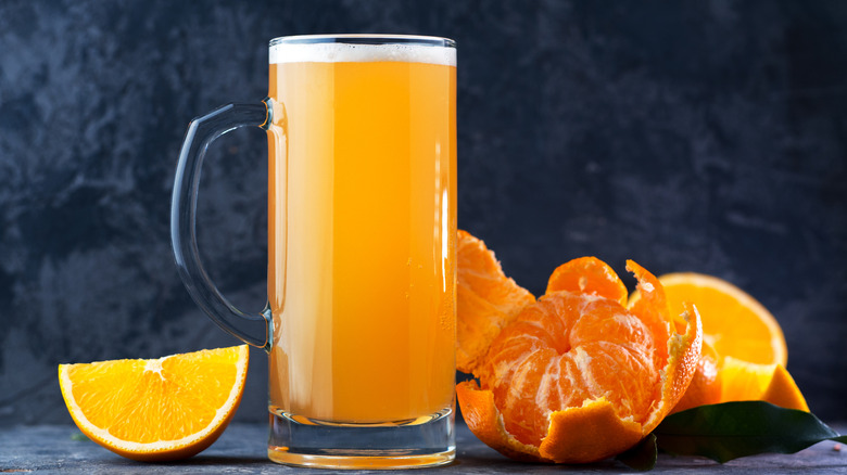 glass stein of radler beer with oranges