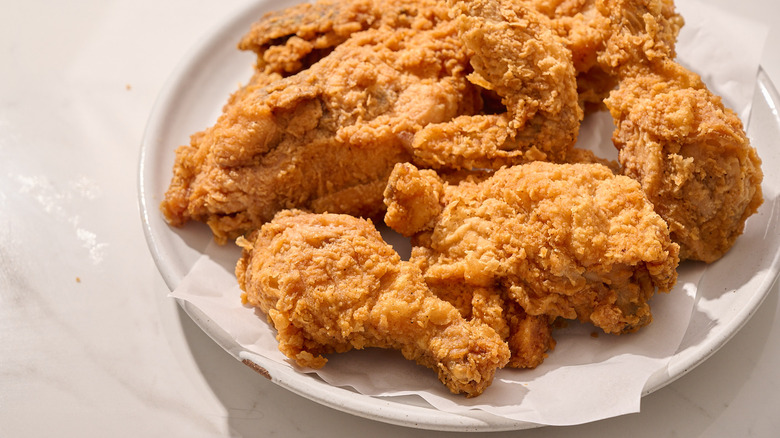 fried chicken piled onto a plate