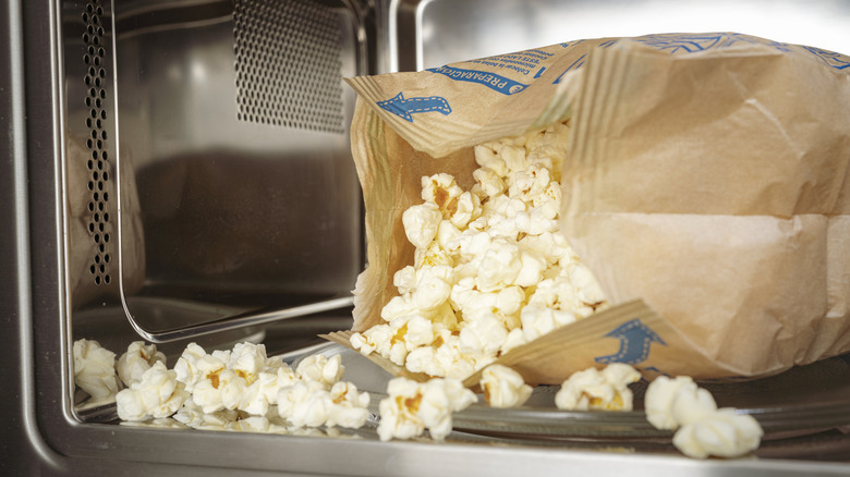 microwave popcorn spilling out of the bag