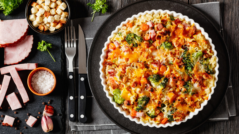 broccoli and noodle casserole topped with cheese