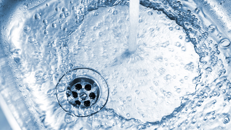 Water flowing into a stainless steel sink