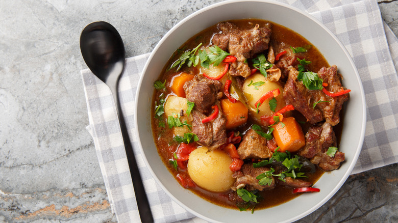 Beef in a stew with carrots and potatoes