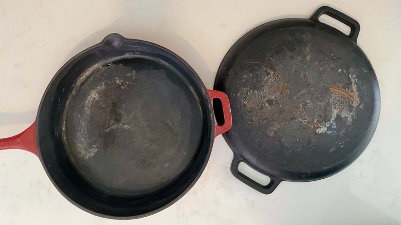 two old cast iron pans