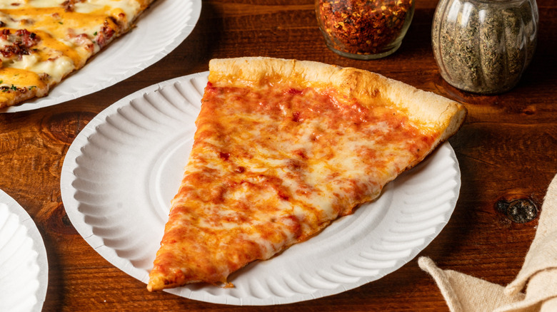 Slice of authentic NY pizza which looks orange