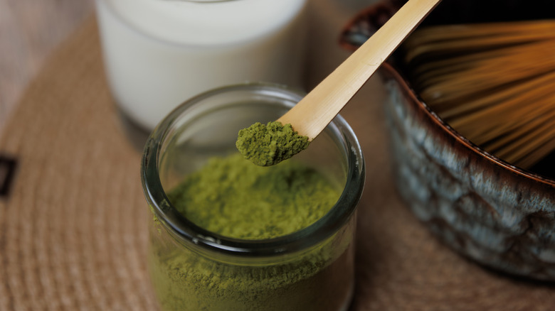 A scoop of bright green matcha powder.