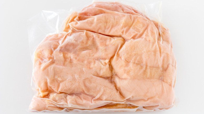 Frozen chicken meat vacuum packed in plastic