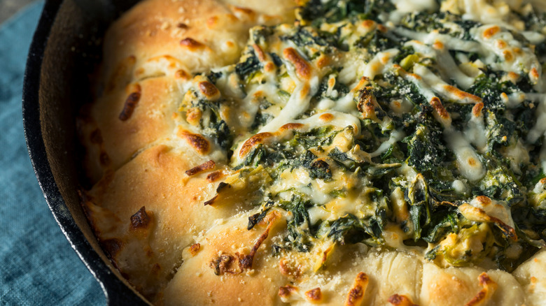 Spinach and artichoke dip in skillet bread