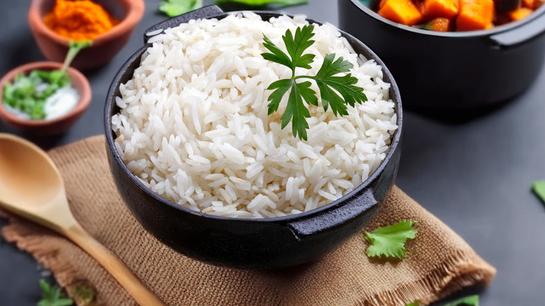 steamed white rice in an iron pot