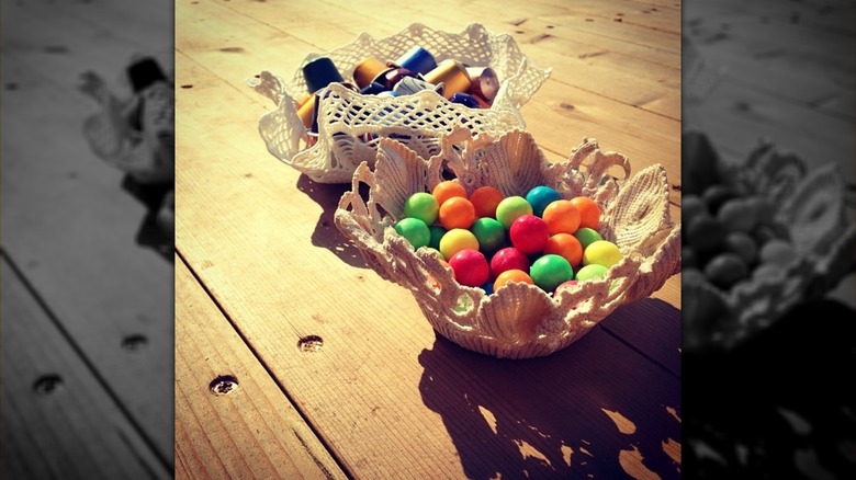 Doily bowls with candy and coffee pods