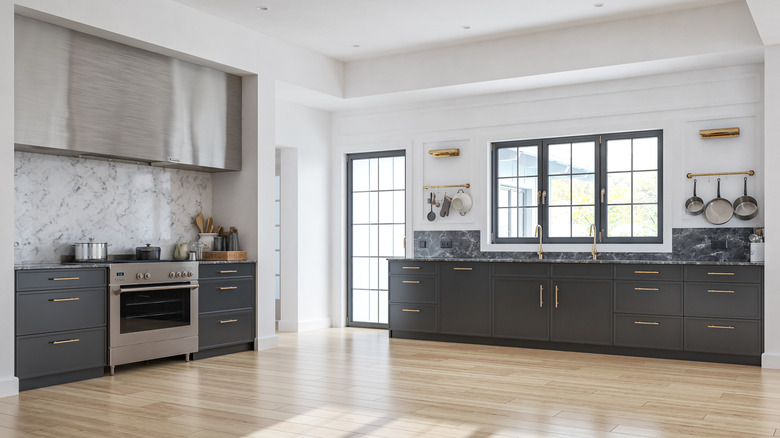 Modern kitchen with light colored flooring