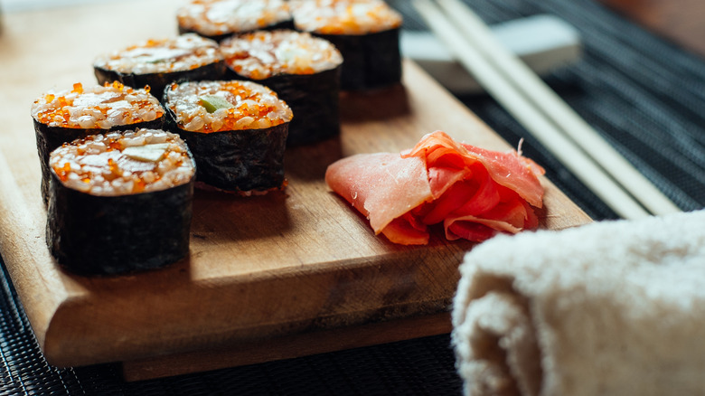 Place setting with sushi and towel