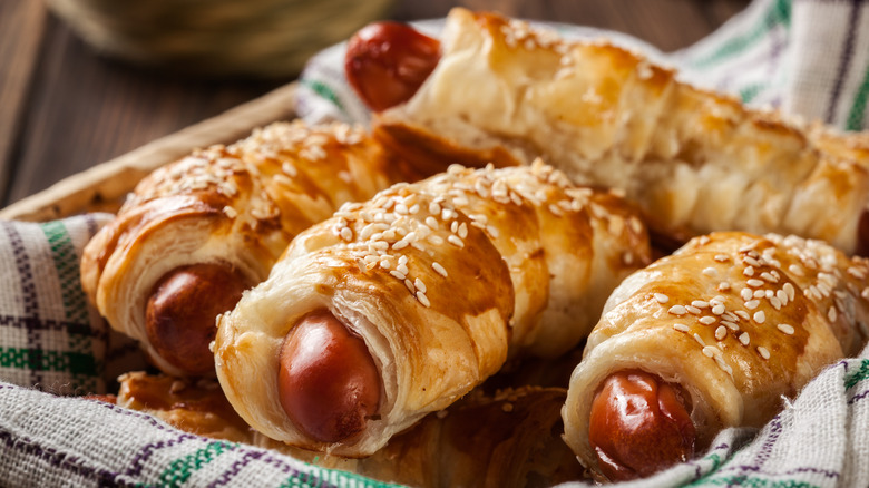 Giant pigs in a blanket in a basket