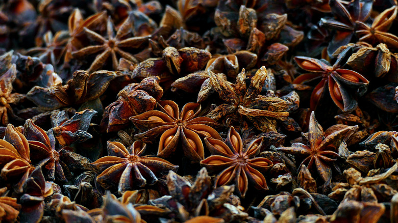 Star anise in various stages of toasting