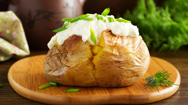 Baked potato topped with sour cream
