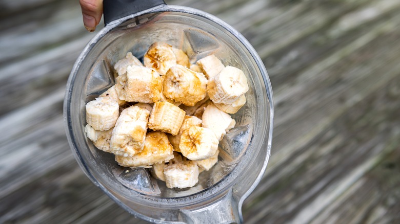 Blender with banana in it
