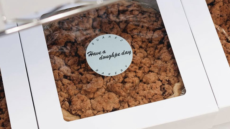 Suarez box with a pie and signature sticker