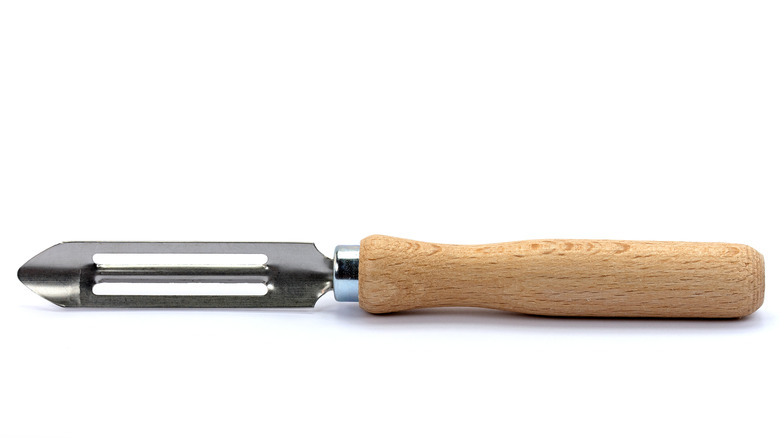 Vegetable peeler laying on its side
