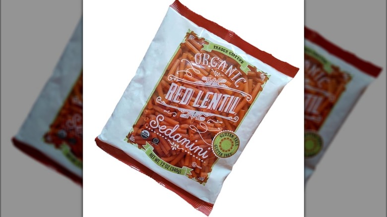 Red lentil pasta on white background