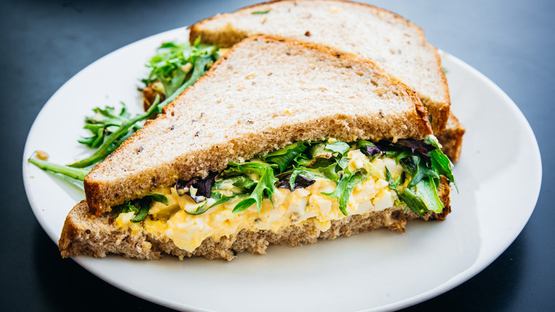 IKEA Egg Salad Sandwich on a plate on a black table