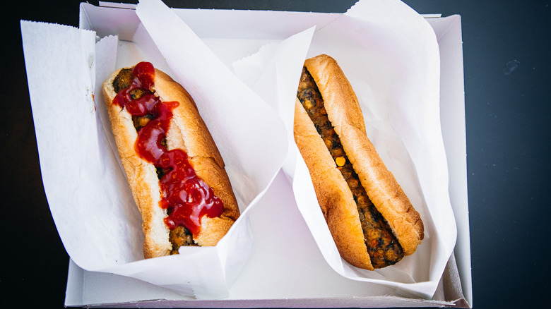 Two IKEA Veggie Dogs in a cardboard box